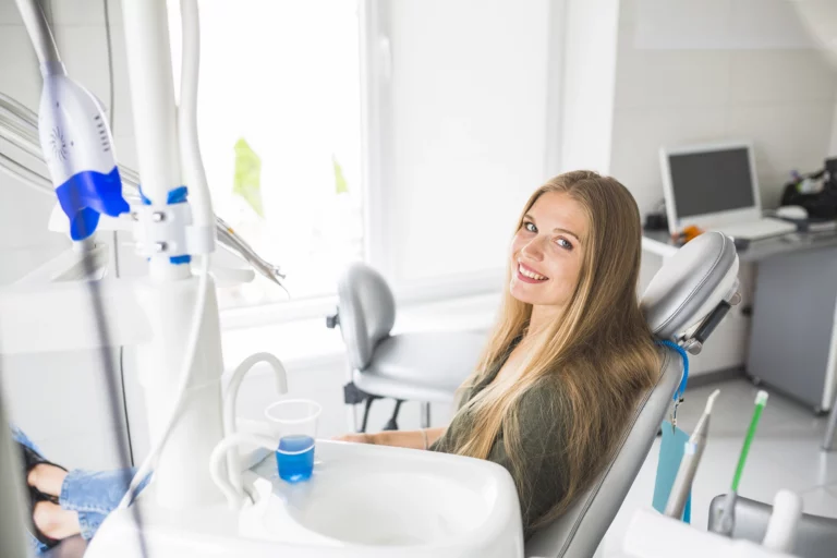 https://leads.keepsmiletravel.co.uk/wp-content/uploads/2023/09/happy-young-woman-sitting-dental-chair-768x512.webp